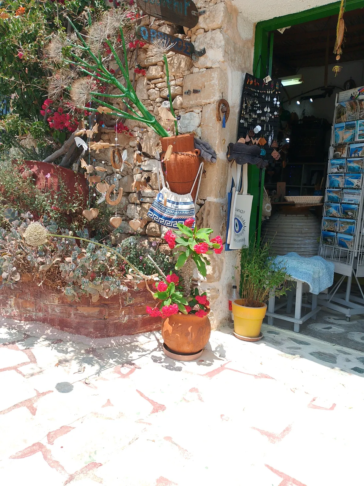 Shop entrance with flowers and olive wood crafts